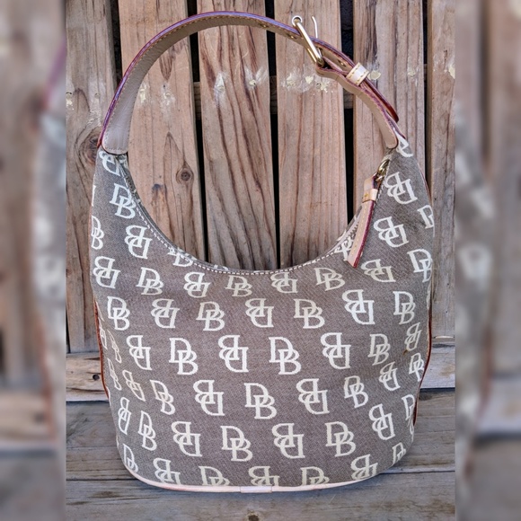 Dooney & Bourke Handbags - NWOT Dooney & Bourke Beige Baby Bucket Bag